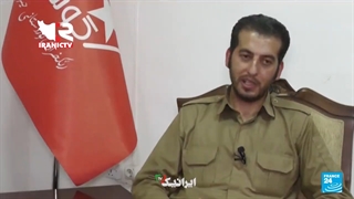 حضور پسرخاله "مهسا امینی" با لباس و پرچم رسمی حزب تروریستی و تجزیه طلب کومله